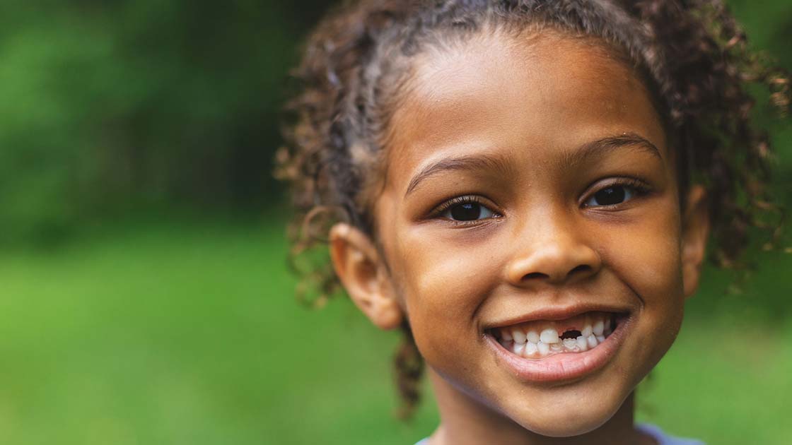 girl with missing tooth